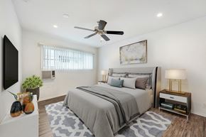 Sherman Oaks apartment for rent - A bedroom with a large bed and a ceiling fan.