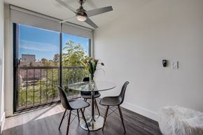 Los Angeles apartment for rent - A dining room with a table and chairs and a ceiling fan.