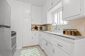 West Hollywood apartment for rent - a white kitchen with a sink and a window