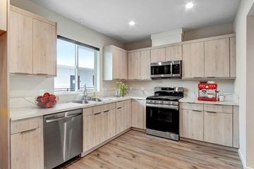Valley Village apartment for rent - A modern kitchen with wooden cabinets and stainless steel appliances.
