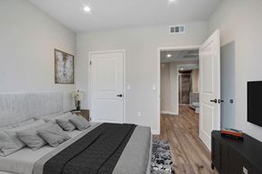 Valley Village apartment for rent - a bedroom with a large bed and a tv