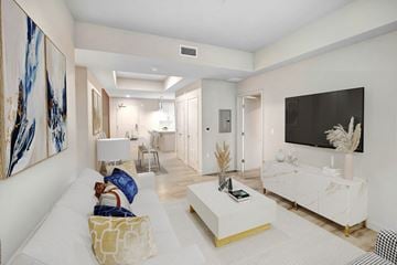 Los Angeles apartment for rent - A living room with a white couch and a large painting on the wall.