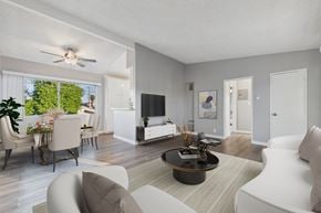 North Hollywood apartment for rent - A modern living room with a white sofa and a coffee table.