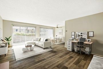 Northridge apartment for rent - A living room with a white couch and a wooden floor.