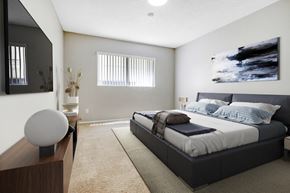 Los Angeles apartment for rent - A modern bedroom with a large bed and a large painting on the wall.