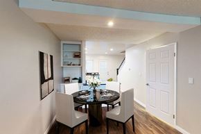 Los Angeles apartment for rent - A dining room with a table set for two and a painting on the wall.