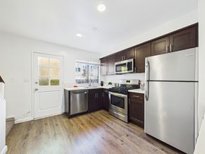 Los Angeles apartment for rent - A kitchen with a stainless steel refrigerator, oven, and microwave.