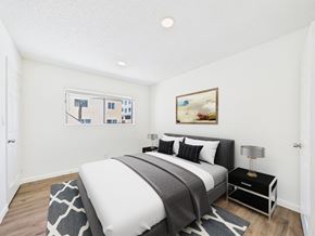 Los Angeles apartment for rent - A bedroom with a large bed and a painting on the wall.