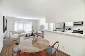 Northridge apartment for rent - a living room with a table and a couch and a kitchen