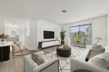 North Hollywood apartment for rent - A living room with a white couch and a television.