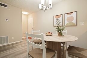 Sherman Oaks apartment for rent - A dining room with a round table and chairs.