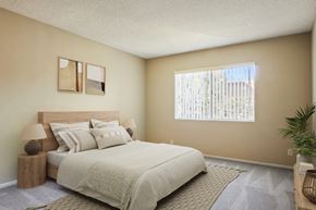 Sherman Oaks apartment for rent - A bedroom with a large bed and a window with blinds.