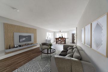 Burbank apartment for rent - A living room with a grey sofa and a television.