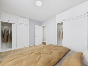 Los Angeles apartment for rent - A bedroom with a bed and a wardrobe.