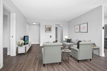 Burbank apartment for rent - A living room with a grey couch and a white coffee table.