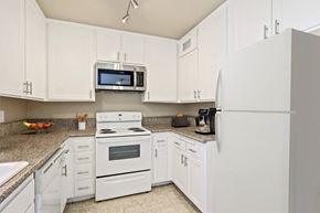 Los Angeles apartment for rent - a kitchen with white appliances and white cabinets