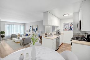 Reseda apartment for rent - a kitchen and living room with a table and a sink