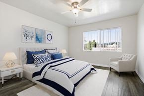 Beverly Hills apartment for rent - A bedroom with a large bed and a chair.