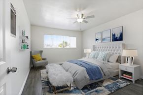 Beverly Hills apartment for rent - A bedroom with a bed, a chair, and a ceiling fan.
