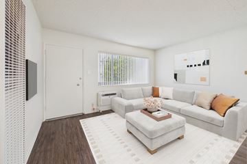 Canoga Park apartment for rent - A living room with a white couch and a coffee table.