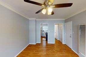 Los Angeles apartment for rent - A room with a ceiling fan and wooden floors.