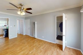 Los Angeles apartment for rent - A room with a ceiling fan and wooden floors.