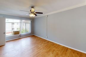 Los Angeles apartment for rent - A room with a ceiling fan and a window with blinds.