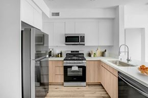 Winnetka apartment for rent - a modern kitchen with stainless steel appliances and white cabinets