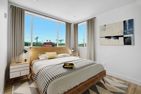 Winnetka apartment for rent - a bedroom with a bed and large windows