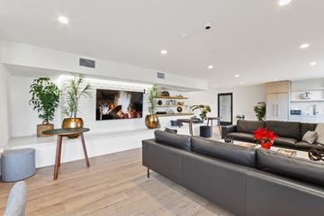Los Angeles apartment for rent - A modern living room with a grey sofa and a wooden table.