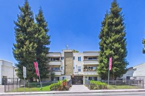 Panorama City apartment for rent - A modern building with a flag on the left and right side.