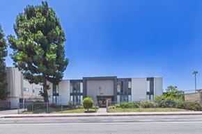 Panorama City apartment for rent - A modern building with a tree in front of it.