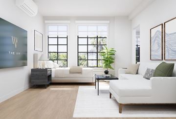 Los Angeles apartment for rent - A living room with a white couch and a black coffee table.
