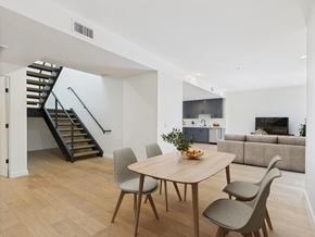 Los Angeles apartment for rent - A dining room with a round table and chairs.
