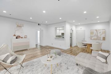 Los Angeles apartment for rent - A white living room with a white rug and a white coffee table.