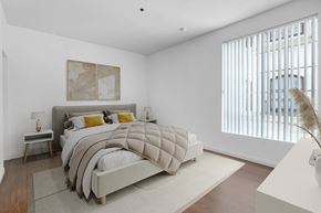 Los Angeles apartment for rent - a bedroom with a bed and a large window