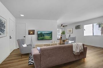 Los Angeles apartment for rent - A living room with a couch, chair, and a painting on the wall.