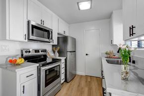 Los Angeles apartment for rent - a kitchen with white cabinetry and stainless steel appliances
