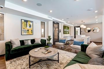 Azusa apartment for rent - A living room with a green couch and a coffee table.