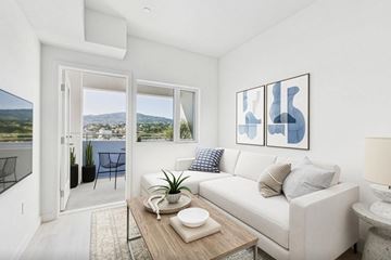 San Pedro apartment for rent - A living room with a white couch and a coffee table.