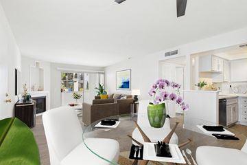 Burbank apartment for rent - A modern living room with a glass table and white chairs.