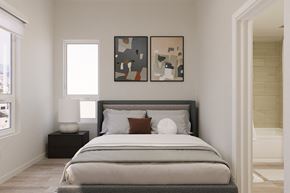 Culver City apartment for rent - A bedroom with a large bed and two abstract paintings on the wall.