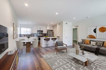Van Nuys apartment for rent - A modern living room with a grey sofa and a coffee table.