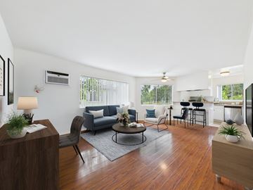 Los Angeles apartment for rent - A living room with a grey couch and a wooden floor.