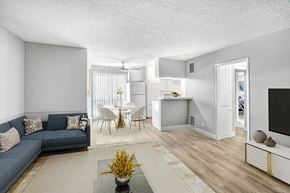 North Hollywood apartment for rent - a living room and kitchen with a couch and a table
