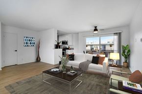 Los Angeles apartment for rent - a living room with a white couch and a glass coffee table