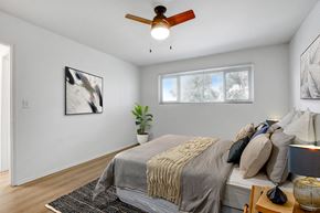 Los Angeles apartment for rent - a bedroom with a large bed and a ceiling fan