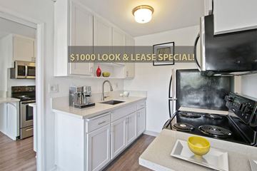 Los Angeles apartment for rent - A kitchen with a stove and a counter with a yellow bowl on it.