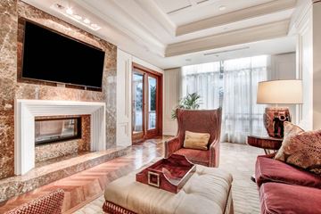 Los Angeles apartment for rent - A living room with a fireplace and a television above it.