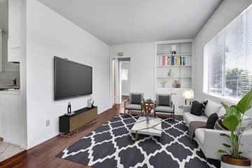 Los Angeles apartment for rent - A living room with a large television and a patterned rug.